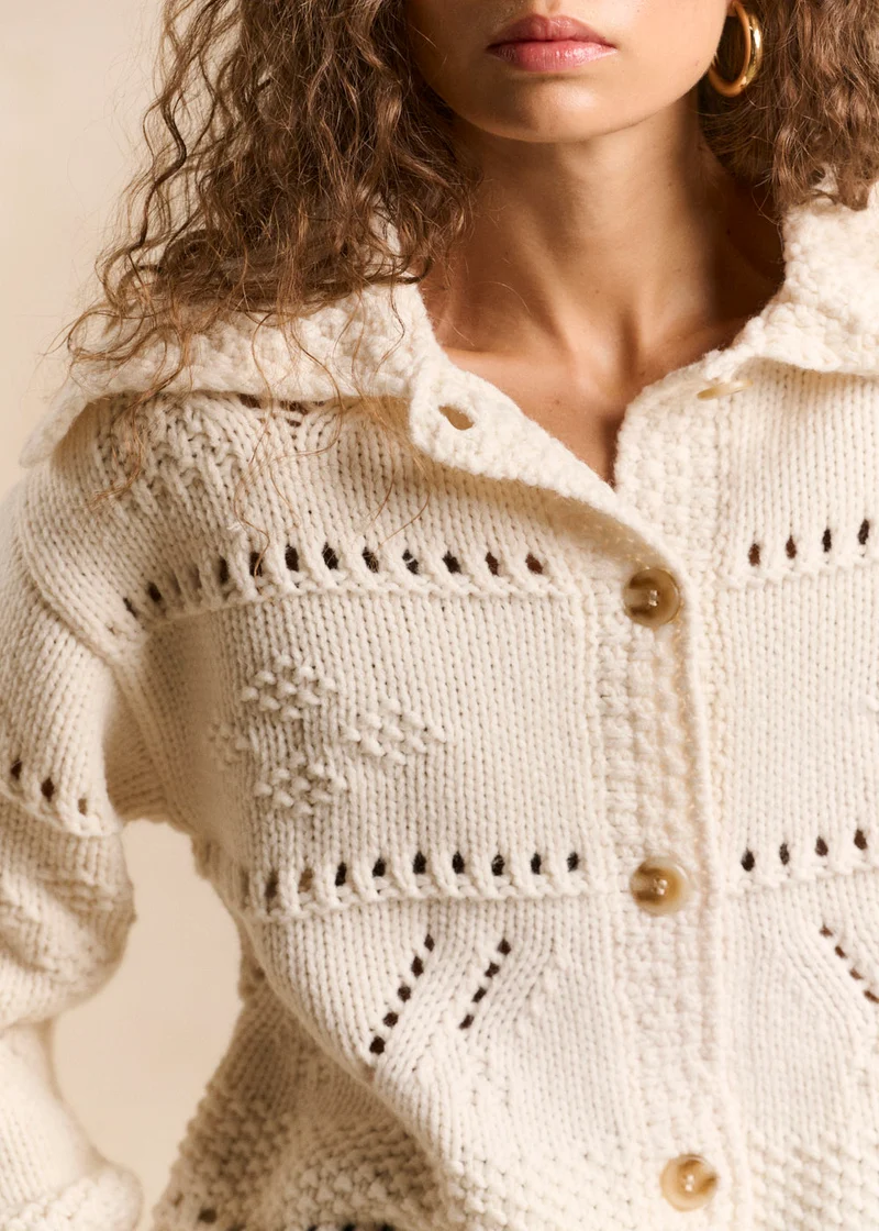 Gilet jacquard fleuri à grand col