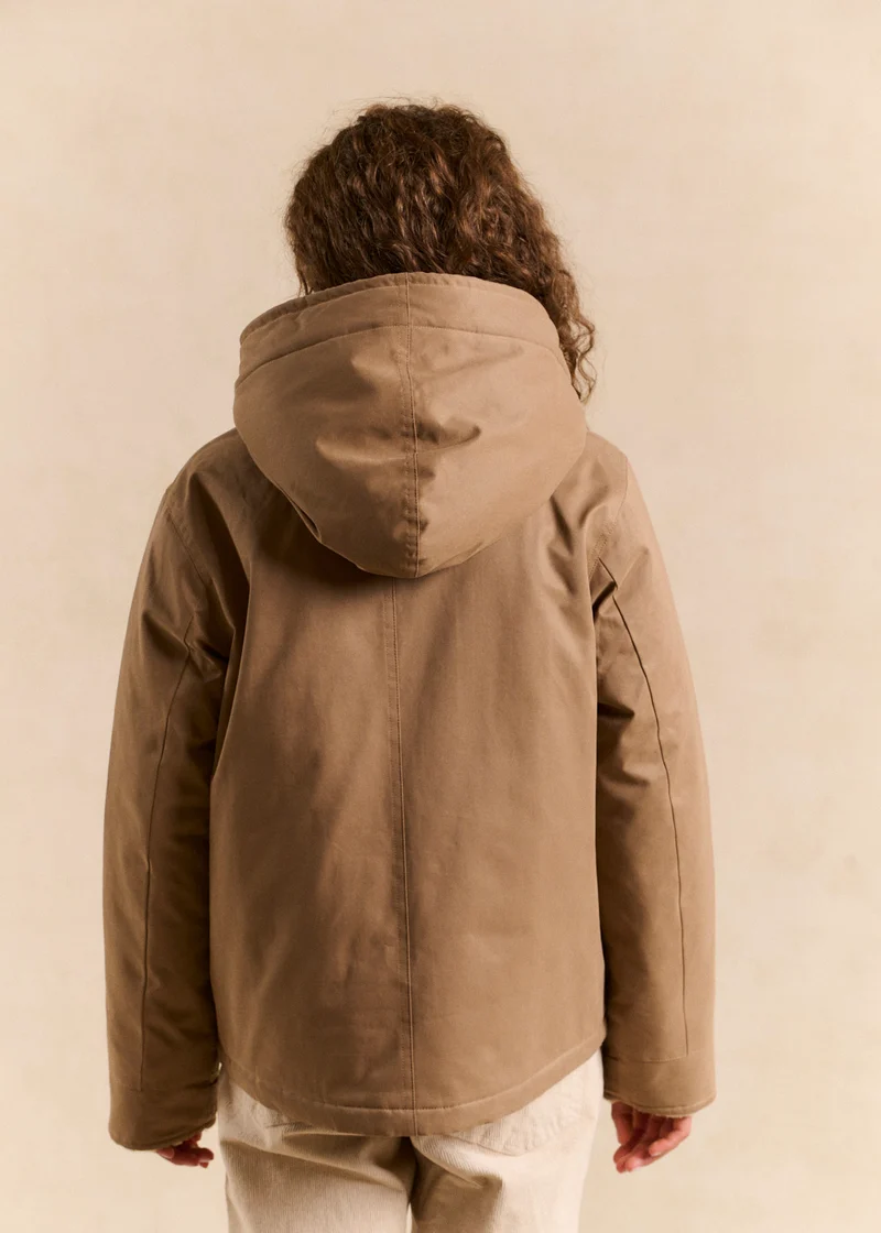 Veste courte déperlante doublée fausse fourrure avec capuche