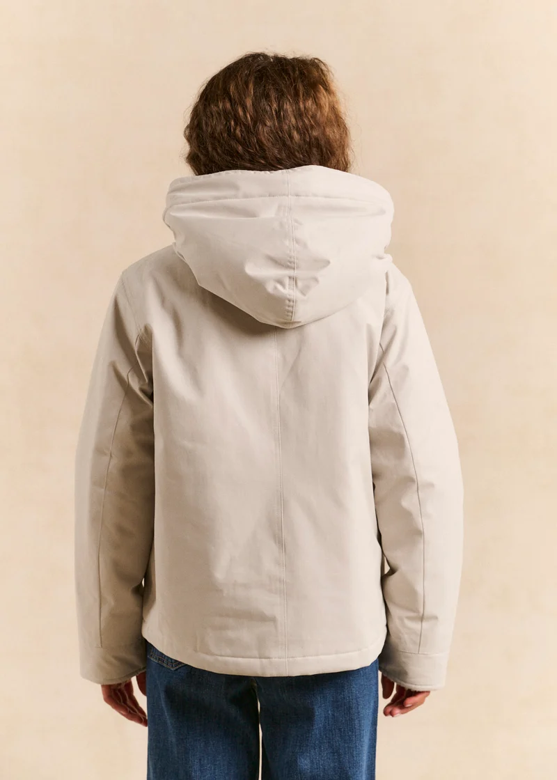 Veste courte déperlante doublée fausse fourrure avec capuche